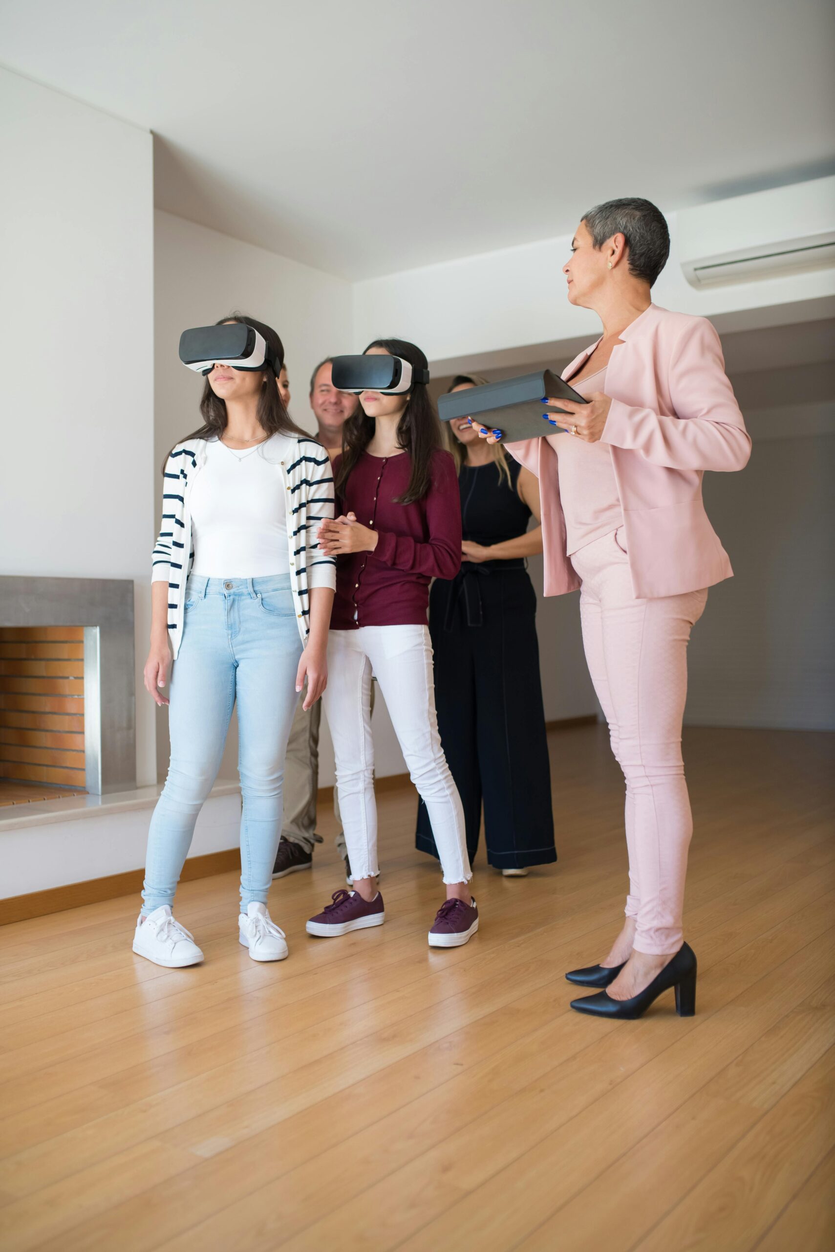 Group exploring a house using VR technology with a real estate agent in Portugal.
